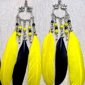 Silver chandelier yellow & black feather earrings